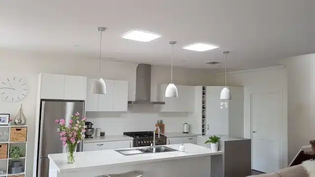 Two square solatube 290ds providing natural light over the kitchen bench